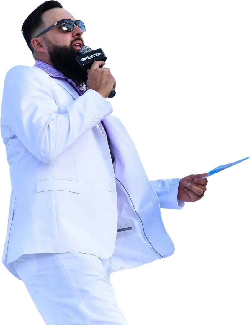Bradley Hart in a white suit holding a Sparta microphone and event card